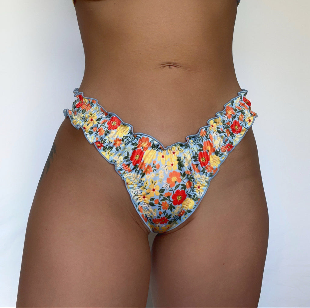 Floral ruffled recycled sustainable eco friendly bikini bottom lettuce hem thong v waist high cut
